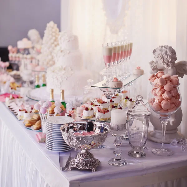 Dessert table for a party. Ombre cake, cupcakes, sweetness and f Royalty Free Stock Photos