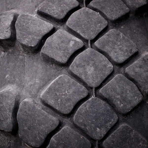 Close-up de piso pneu trator como fundo . — Fotografia de Stock