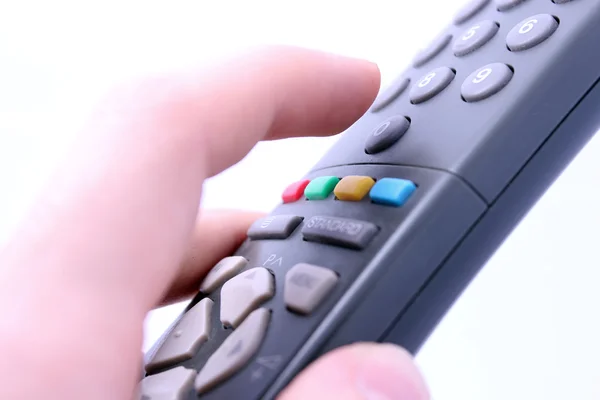 Finger pressing remote control button — Stock Photo, Image