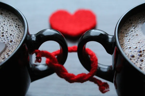 Two cups of coffee and red heart on the background — Stock Photo, Image