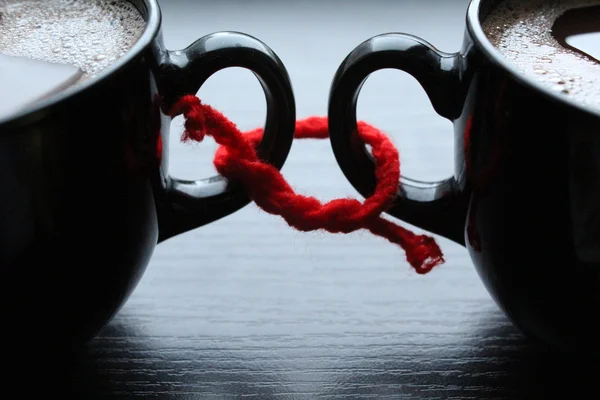 Two cups of coffee related red thread — Stock Photo, Image