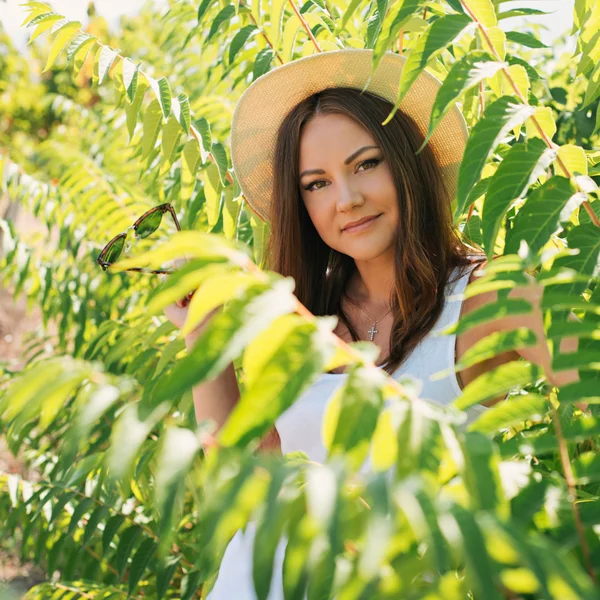 Beautiful young woman in stylish hat — Stock Photo, Image