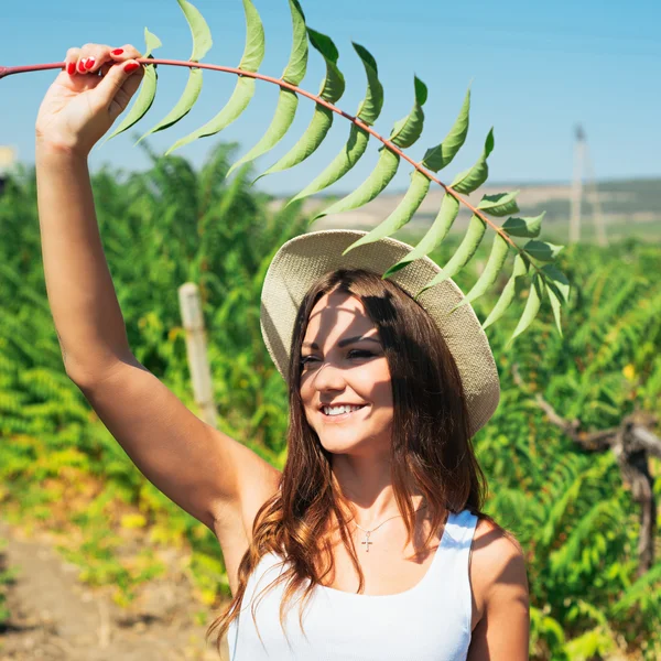 Beautiful young woman in stylish hat — Stock Photo, Image