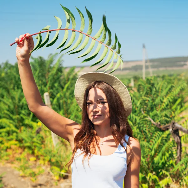 Beautiful young woman in stylish hat — Stock Photo, Image