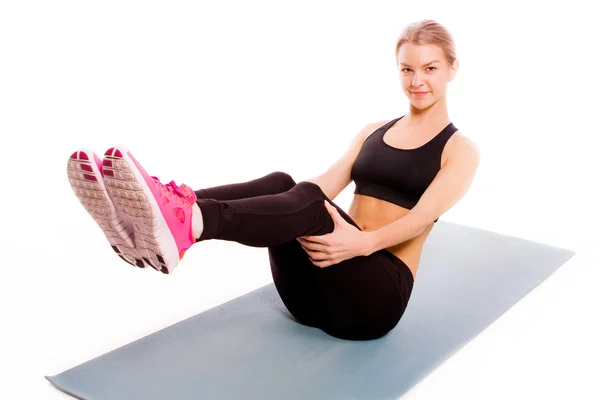 Retrato de mujer fitness aislado sobre fondo blanco. Sonriendo hap — Foto de Stock