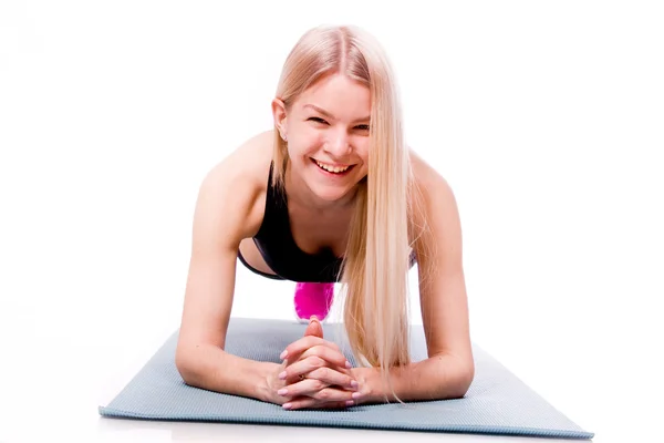 Fitness-Frau blickt auf Kamera isoliert auf weißem Hintergrund. sm — Stockfoto