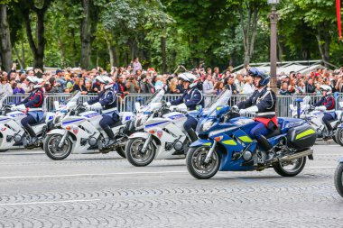 PARIS, FRANCE - JULY 14, 2014: Military parade of National Gendarmerie (Defile) during the ceremonial of french national day, Champs Elysee avenue. clipart