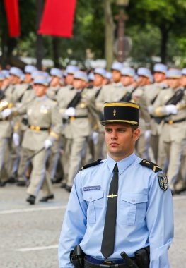 PARIS, FRANCE - JULY 14, 2014: Military parade (Defile) during the ceremonial of french national day, Champs Elysee avenue. clipart