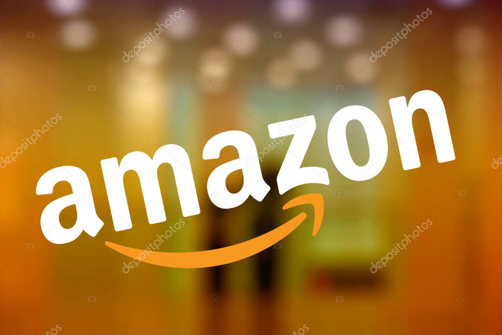 SEATTLE, WASHINGTON/USA - June 2, 2019:Selected Focus on the Amazon logo displayed on the window of an Amazon bookstore called Amazon Books