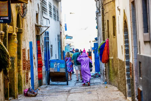 People walking in a narrow downtown street — Stock Photo, Image