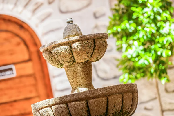 A designed stone fountain in the backyard — Stock Photo, Image