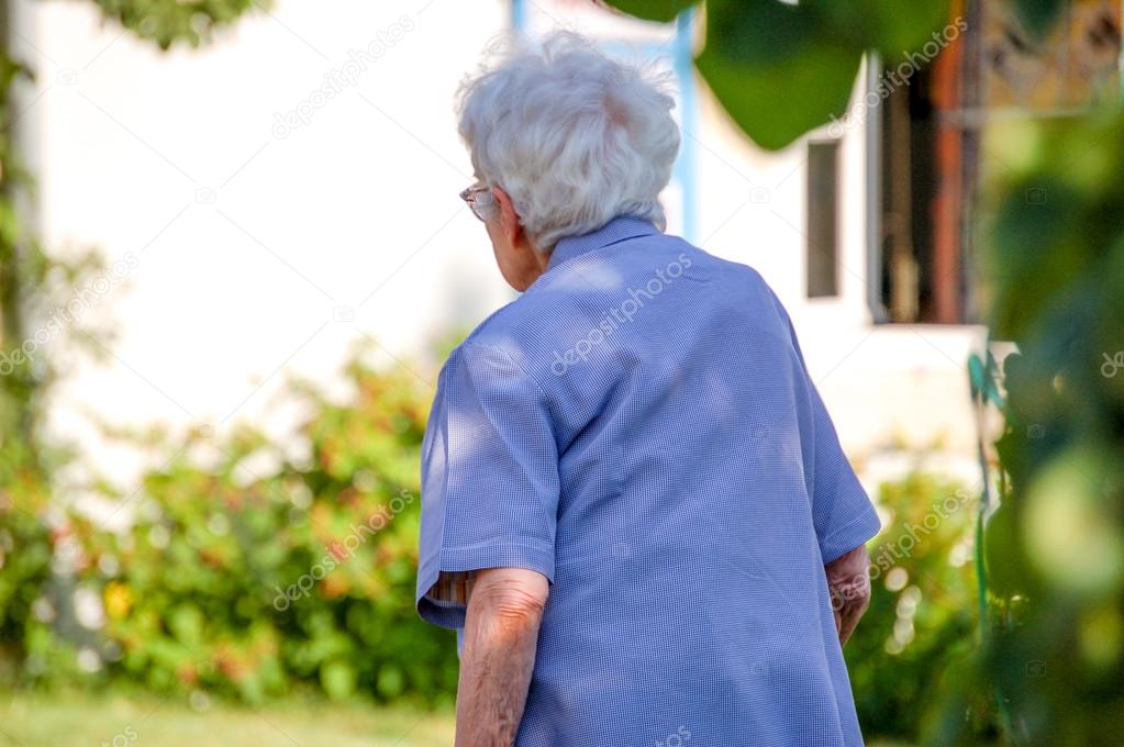 Old woman seen from behind. — Stock Photo © Pixinooo #52815941