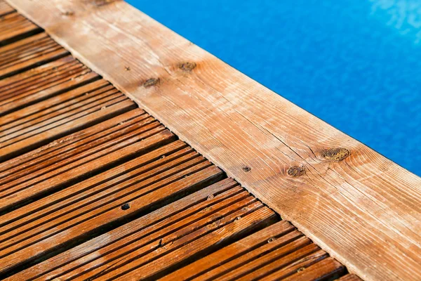 Swimming pool with treated wood damaged — Stock Photo, Image