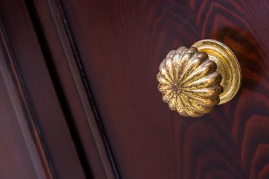 Metal Door Knob on old venitian wooden door clipart