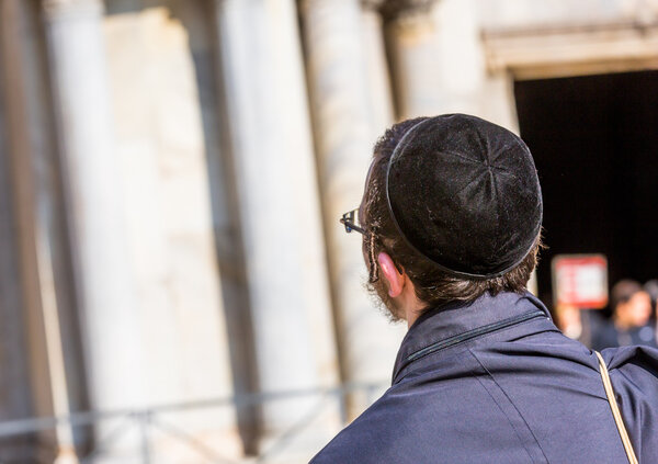 Confession Jewish man front of a church