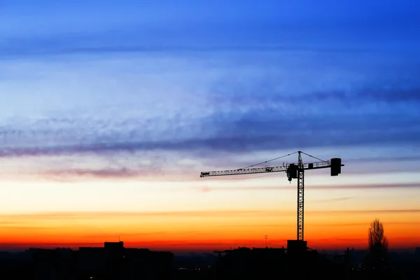 Edificios en construcción con puesta de sol — Foto de Stock