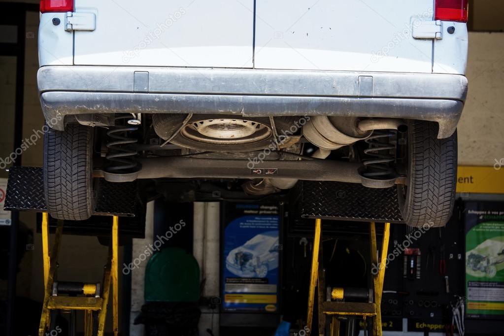 Close Up of shock absorbers replacement in a garage