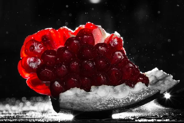 Pomegranate on a black background — Stock Photo, Image