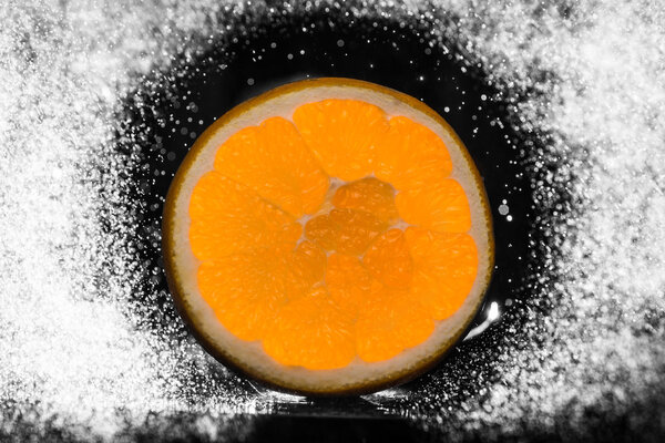 wet orange on a black background