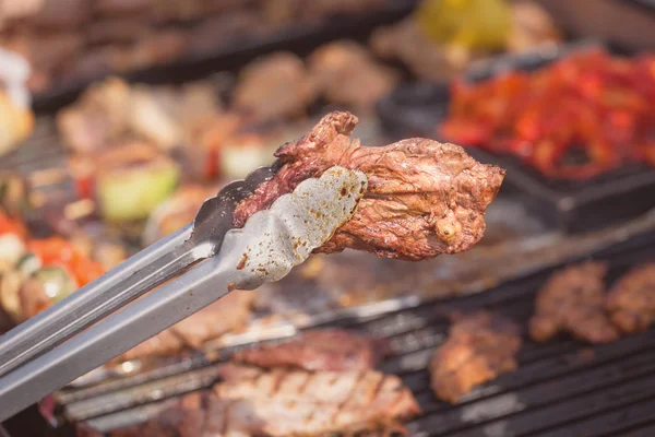 Roasted meat on the grill, parrilla, asado — Stock Photo, Image