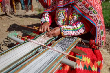 The woman weaves multi-colored fabrics, Huillos, Sacred Valley,  clipart