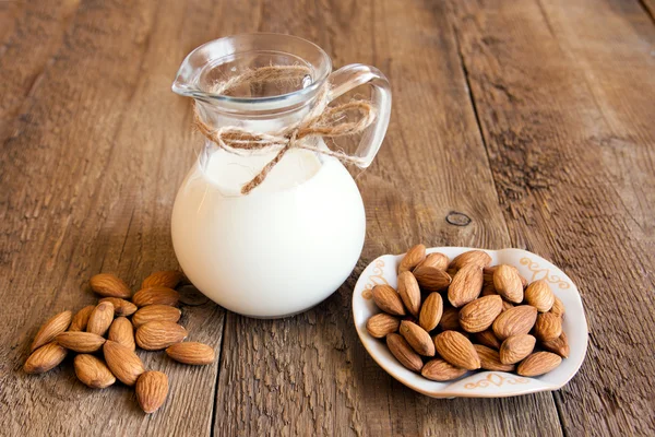 Almond milk and nuts — Stock Photo, Image