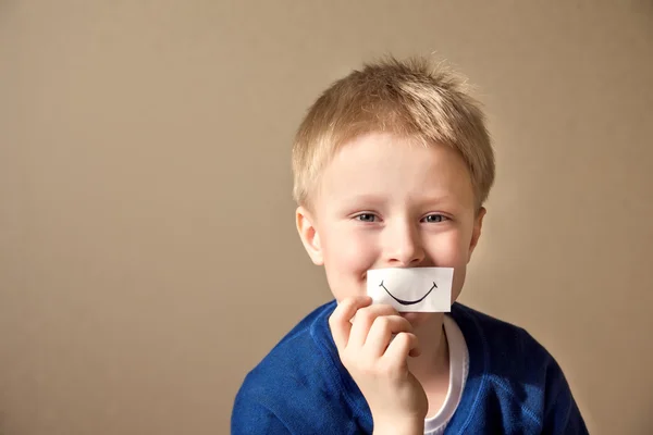 Happy boy (teen) with paper smile — Stock Photo, Image