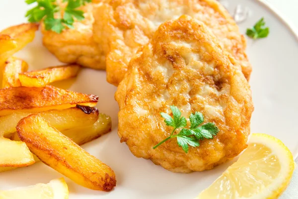 Fish cakes with french fries — Stock Photo, Image