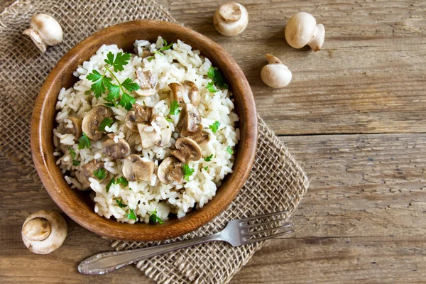Mushroom risotto in wooden bowl — Stock Photo, Image