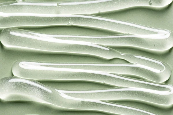 Textura Gel Sobre Fondo Verde Cerca Golpes Del Producto Cosmético — Foto de Stock