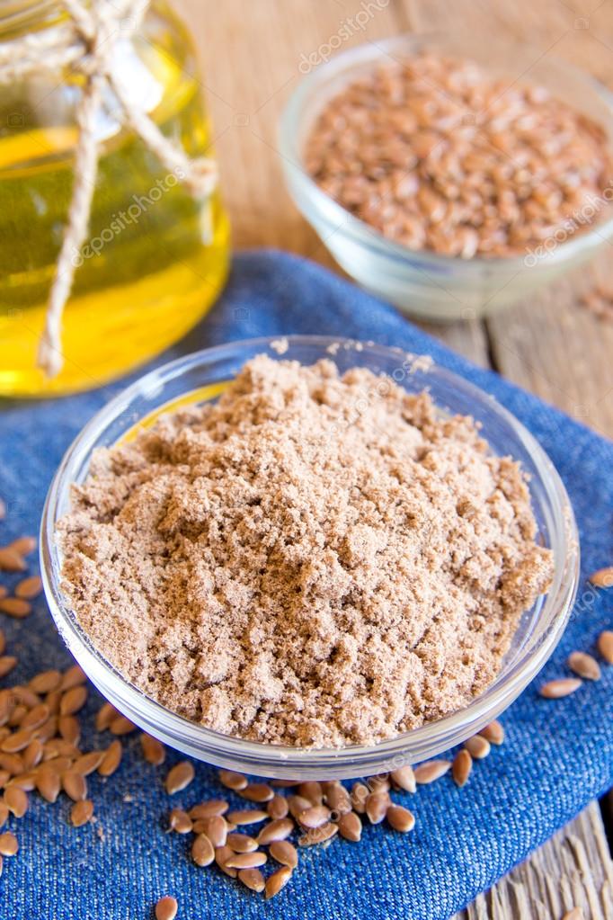 Flax powder and seeds — Stock Photo © Mizina 74486837