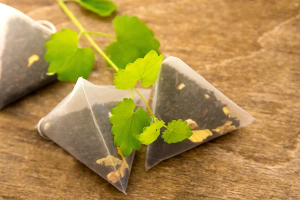 Teabags with melissa (mint) — Stock Photo, Image