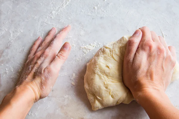Hands kneading dough — Stock Photo, Image