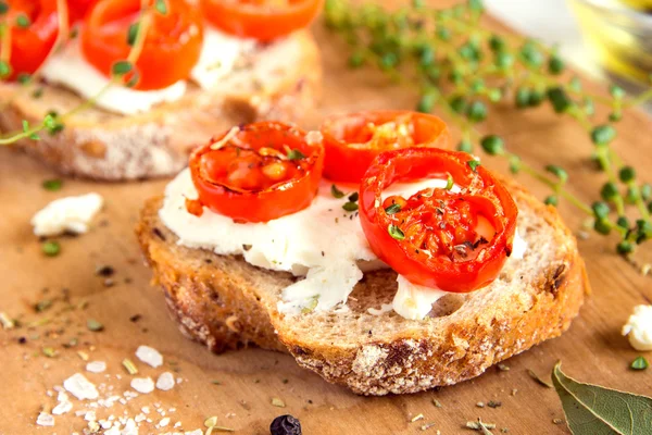Bruschetta with tomatoes and cheese — Stock Photo, Image