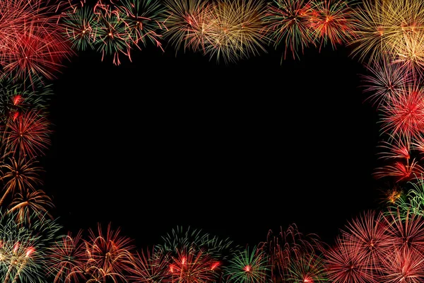 Fireworks border on dark sky background with copy space; celebration and New Year anniversary concept