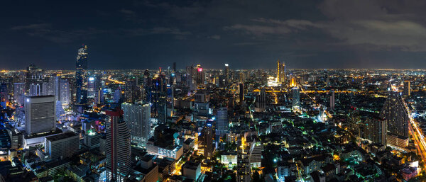 Bangkok business district cityscape with skyscraper at twilight, Thailand - Panorama