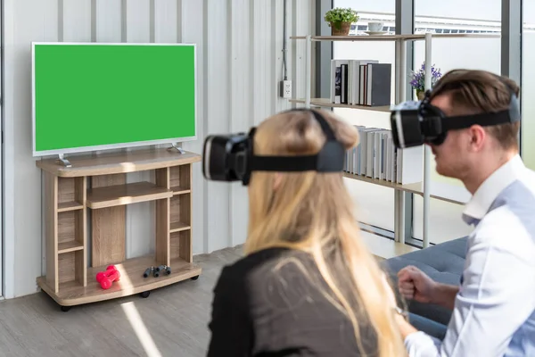 Caucasian Couple Wearing Virtual Reality Headset Goggle Playing Futuristic Game — Stock Photo, Image