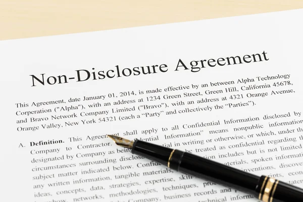 Non disclosure agreement document with pen close-up — Stock Photo, Image