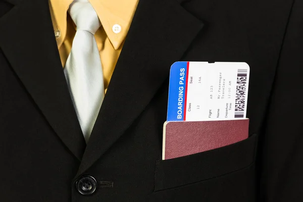 Businessman with passport and boarding pass in pocket concept bu — Stock Photo, Image