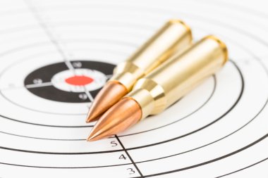 Rifle bullet over target background  clipart