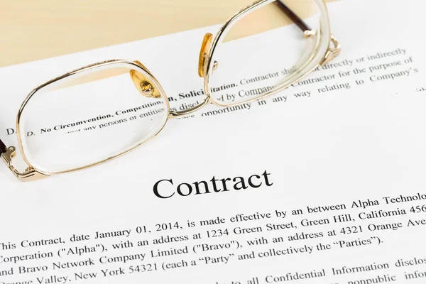 Business contract document with glasses — Stock Photo, Image