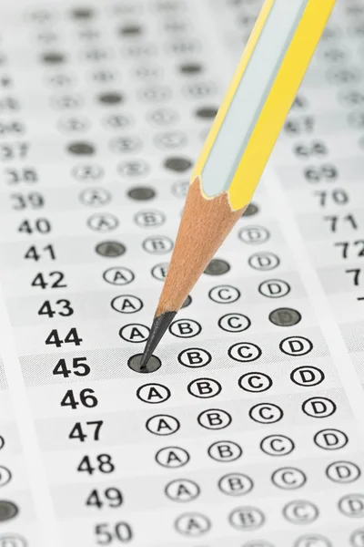 Filled answer sheet focus on pencil — Stock Photo, Image