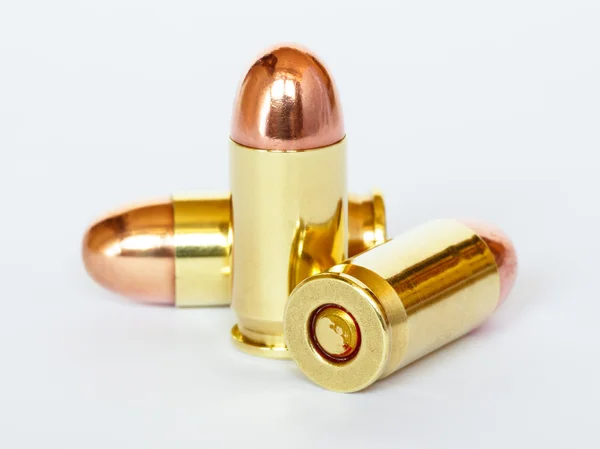 Three 9 mm or .357 bullet on white background — Stock Photo, Image