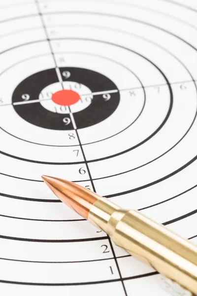 Rifle bullet over target background — Stock Photo, Image