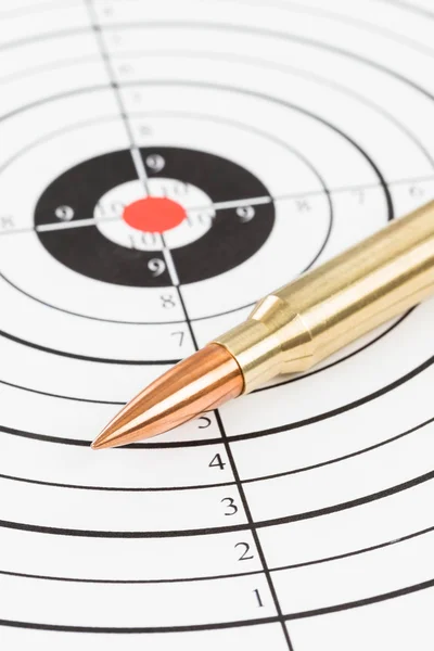 Rifle bullet over target background — Stock Photo, Image