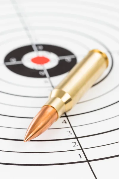 Rifle bullet over target background — Stock Photo, Image