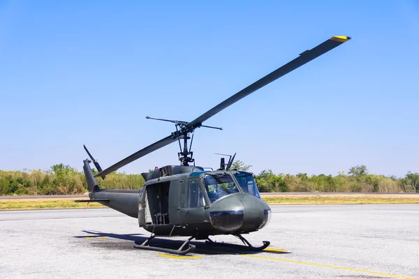 Military helicopter (huey) at a base — Stock Photo, Image