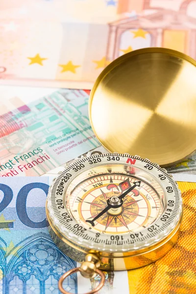 Compass on european banknote concept financial direction — Stock Photo, Image