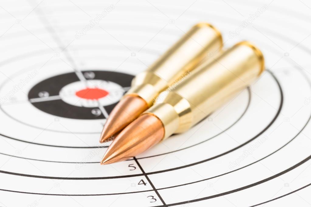 Rifle bullet over target background 
