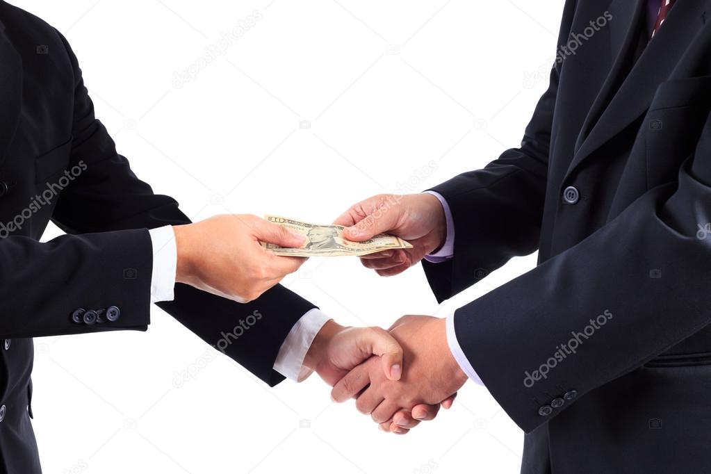 Buisnessmen shaking hands and receiving banknote